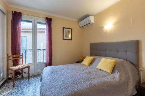 A bed or beds in a room at Orange - Appt à 10min d'Argelès-Sur-Mer