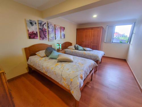 Кровать или кровати в номере Casa en centro de Santana con vista al mar y la montaña