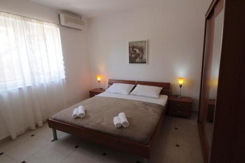 Postel nebo postele na pokoji v ubytování Studios & Rooms Fiesta