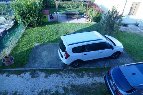 a white car parked in the driveway of a house at Casa Venezia e Riviera in Mirano