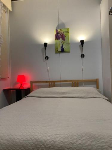 Ένα ή περισσότερα κρεβάτια σε δωμάτιο στο Guesthouse - Kuin Kotonaan