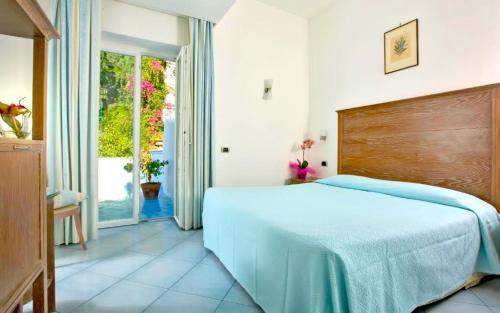 Ένα ή περισσότερα κρεβάτια σε δωμάτιο στο Hotel La Floridiana