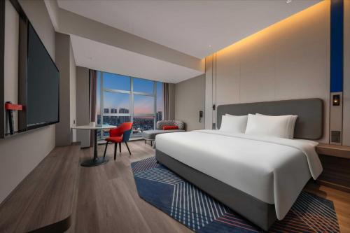 Ένα ή περισσότερα κρεβάτια σε δωμάτιο στο Holiday Inn Express Mianyang Sci-Tech City by IHG