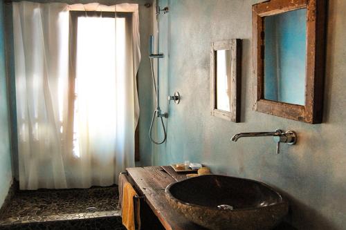 a bathroom with a wooden sink and a window at Eco del Mare in Lerici