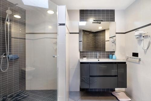 a bathroom with a shower and a sink at Villa Rossella By Paramount Holidays in Adeje