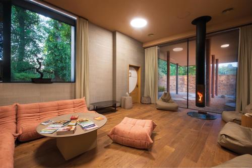 a living room with a couch and a table at Yellison at Broughton Sanctuary in Skipton