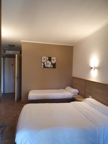 Postel nebo postele na pokoji v ubytování Auberge de la Tour -Appartements-