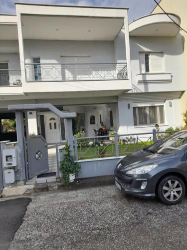 a car parked in front of a house at Zant house in Tríkala