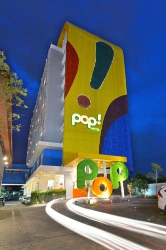 a building with a pdq sign in front of it at POP! Hotel Tanjung Karang in Bandar Lampung