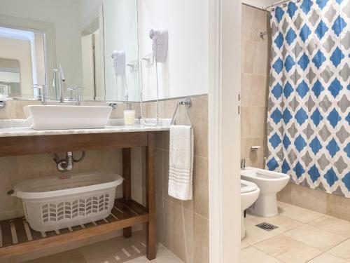 a bathroom with a sink and a toilet at Himmel Blau Rentals in Río Grande