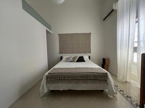 Säng eller sängar i ett rum på Casa vacanze “ZappIng”
