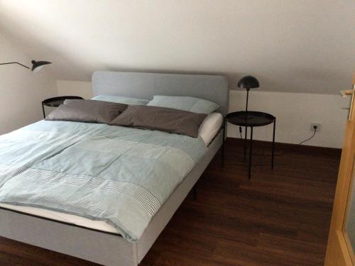 a large bed in a bedroom with a table at #office in Bengel