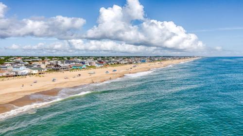 an aerial view of a beach with people on it at Holiday Inn Express Kitty Hawk - Outer Banks by IHG in Kitty Hawk