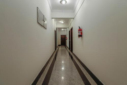an empty hallway with a corridermottermottermottermott at Emara Grand Hotel in Bangalore