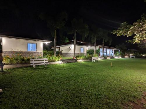 a person standing in a yard at night at VistaBerge - Private, Nature, History in Bagac