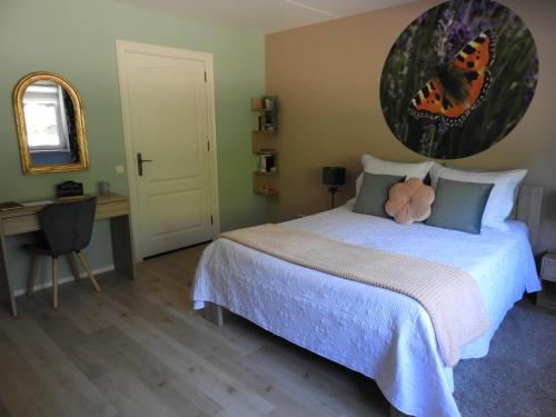 Ένα ή περισσότερα κρεβάτια σε δωμάτιο στο Bed and Breakfast De Kleine Vos