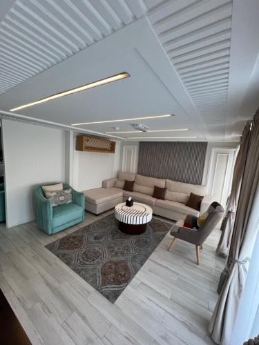 a living room with a couch and a table at Dibba Mountain Park Resort in Fujairah