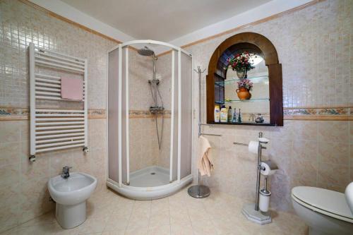 a bathroom with a shower and a toilet and a sink at Casa vacanze Civale con Jacuzzi e parcheggio in Ravello