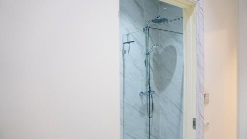 a shower with a glass door in a bathroom at A Hotels Glostrup in Glostrup