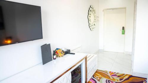 a living room with a flat screen tv on a wall at A Hotels Glostrup in Glostrup
