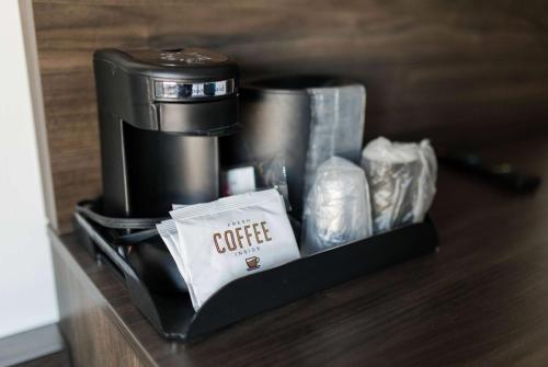a coffee maker sitting on top of a shelf at Travelodge by Wyndham Escanaba in Escanaba