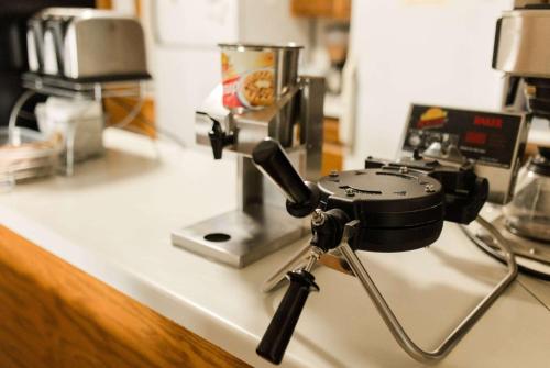 a camera sitting on top of a counter at Travelodge by Wyndham Escanaba in Escanaba