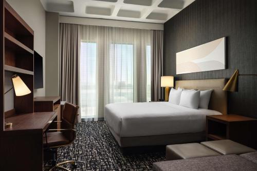 a hotel room with a bed and a desk at Hyatt Place LAX/Century BLVD in Los Angeles