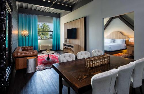 a hotel room with a table and chairs and a bed at Hotel Nyack, a JdV by Hyatt Hotel in Nyack