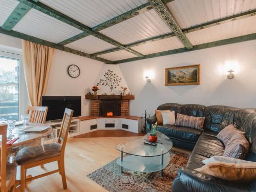 a living room with a couch and a table at Apartment The Alpine Classic by Interhome in Badbruck