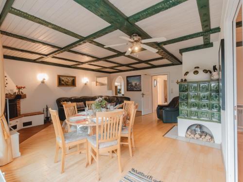 a dining room and living room with a table and chairs at Apartment The Alpine Classic by Interhome in Badbruck