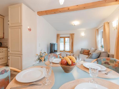 a kitchen and living room with a table and chairs at Holiday Home Ferienhaus Keil by Interhome in Bad Gastein