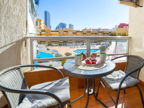 a table with a bowl of fruit on a balcony at Apartment Apolo IV-8 by Interhome in Calpe