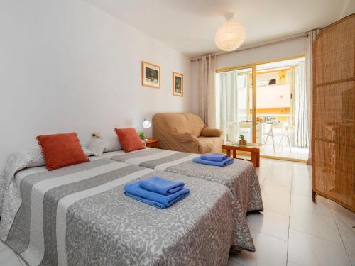 A bed or beds in a room at Studio Apolo VI-6 by Interhome