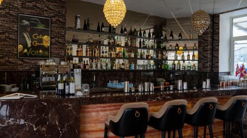 a bar with a lot of bottles of alcohol at A Hotels Glostrup in Glostrup