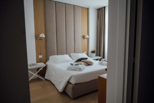 a hotel room with a bed with towels on it at Al Pescatore - B&B in Bari