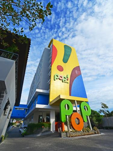 a building with a pepsi sign in front of it at POP! Hotel Tanjung Karang in Bandar Lampung