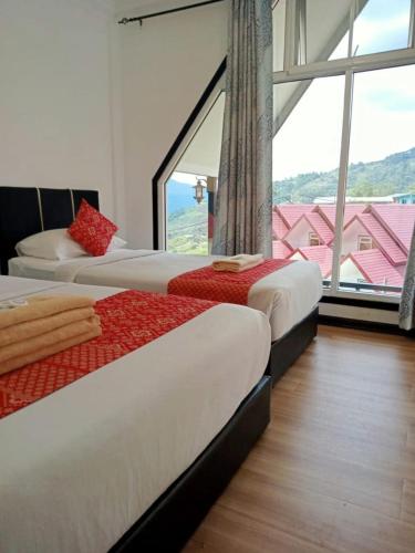 Postel nebo postele na pokoji v ubytování KUNDASANG MOUNT GARDEN