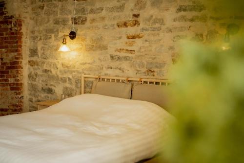 Postel nebo postele na pokoji v ubytování Pilguse Residency