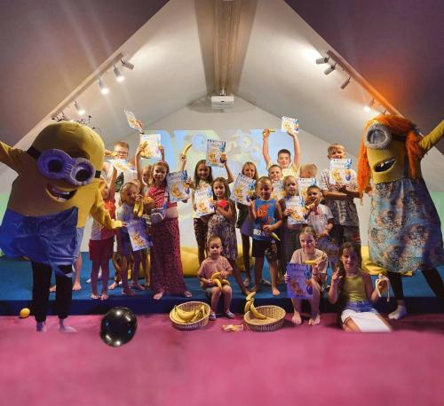 a group of children posing for a picture with mascots at Ведмежа гора Family Resort & Spa in Yaremche