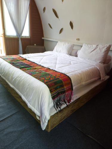 Postel nebo postele na pokoji v ubytování Pondok Wisata Noah