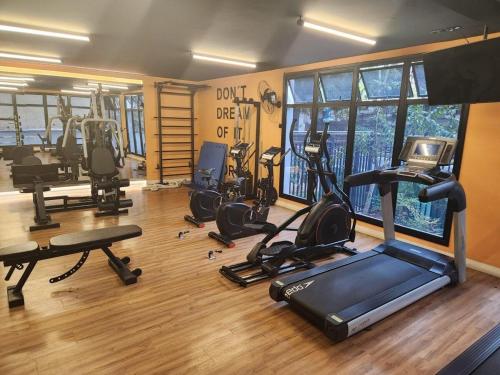 a gym with several exercise equipment in a room at Lofts | Consolação | 3 min Metrô in Sao Paulo