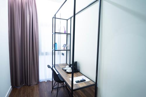 a dressing table with a mirror in a room at Hotel BH San Francisco Alicante in Alicante
