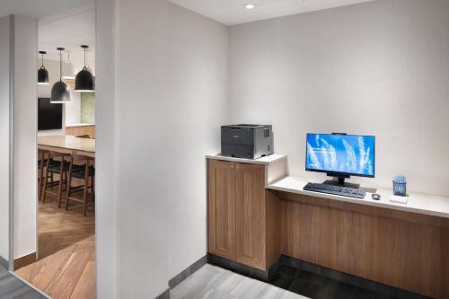 a computer sitting on a counter with a desk at Fairfield Inn & Suites by Marriott West Kelowna in West Kelowna