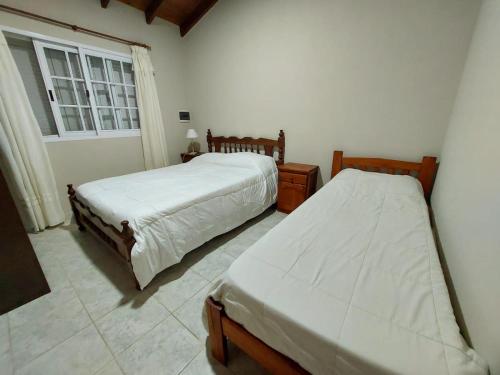 Katil atau katil-katil dalam bilik di Quinta Familiar con Piscina