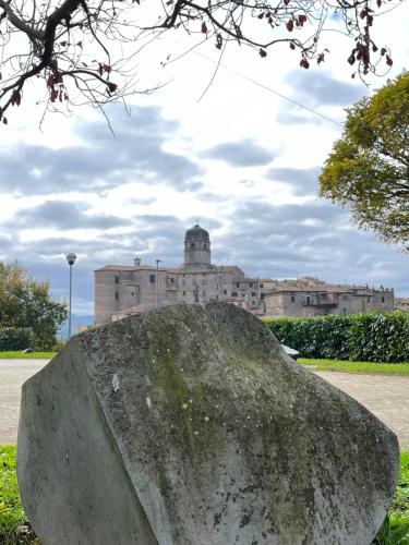 a large rock in front of a building at Villa Felici in Giuliano di Roma
