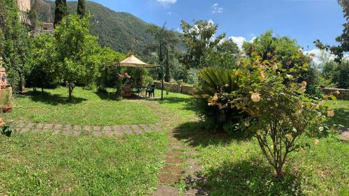 a garden with a gazebo and a tree at Villa Felici in Giuliano di Roma