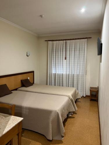Postel nebo postele na pokoji v ubytování Ze da Rampa Hotel