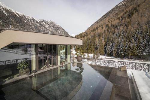 a house with a pool of water with a mountain at SILENA, your soulful hotel - adults only in Valles