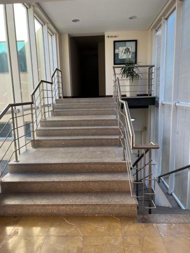 a set of stairs in a building with a hallway at Ze da Rampa Hotel in Aves