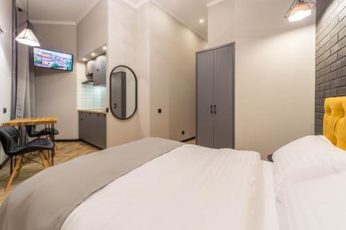 Кровать или кровати в номере Central Apartments Maidan Area